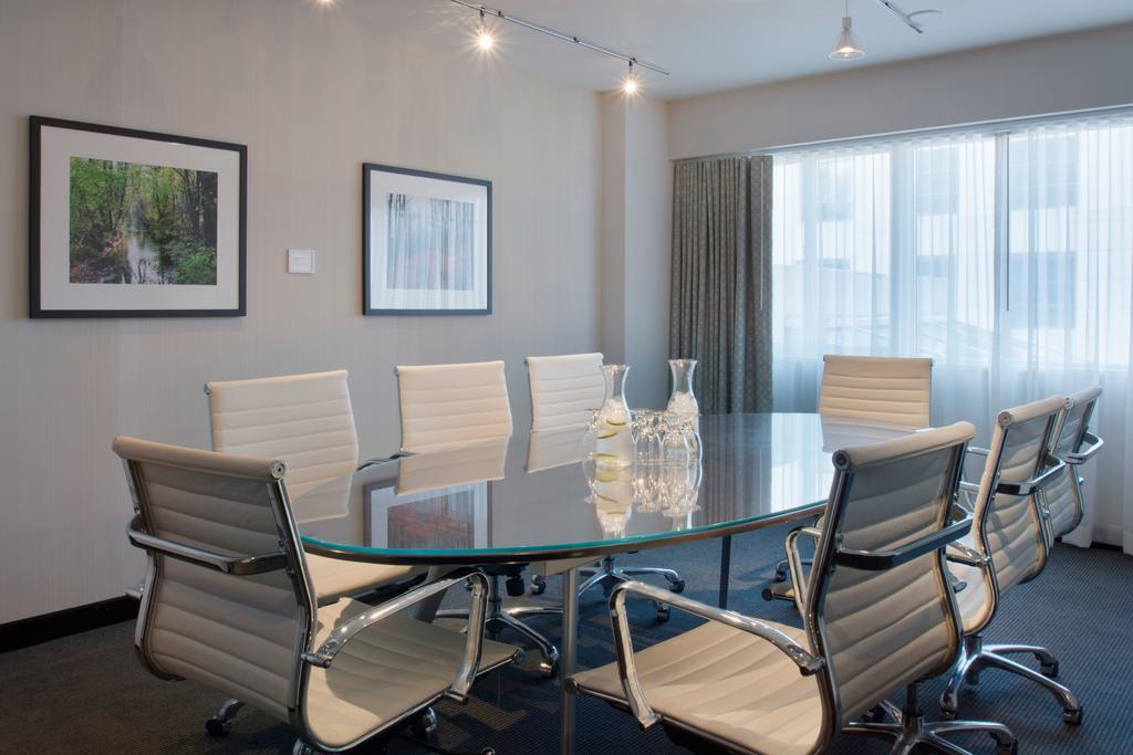 Hotel Murano Такома Экстерьер фото A meeting room at the firm's New York City headquarters
